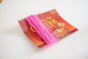 wrap the yarn around the cardboard