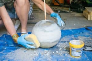use a wet sponge to smooth out concrete