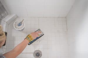 use grout float to apply more grout