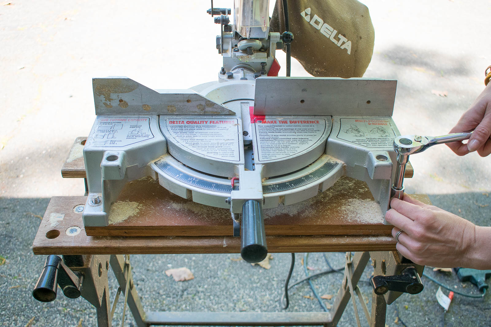 use ratchet to remove the old miter saw