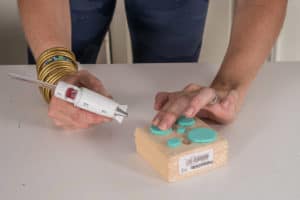 hot glue foam onto scrap wood