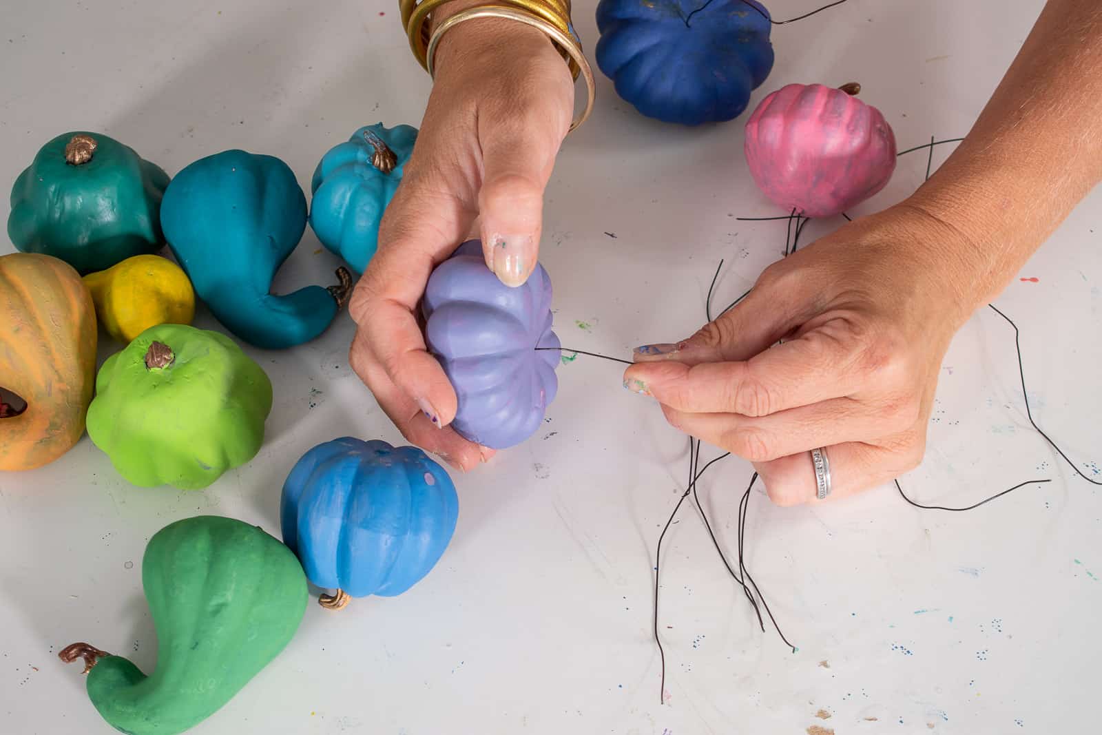 poke the wire into the gourds