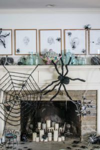spiders crawling on halloween mantel