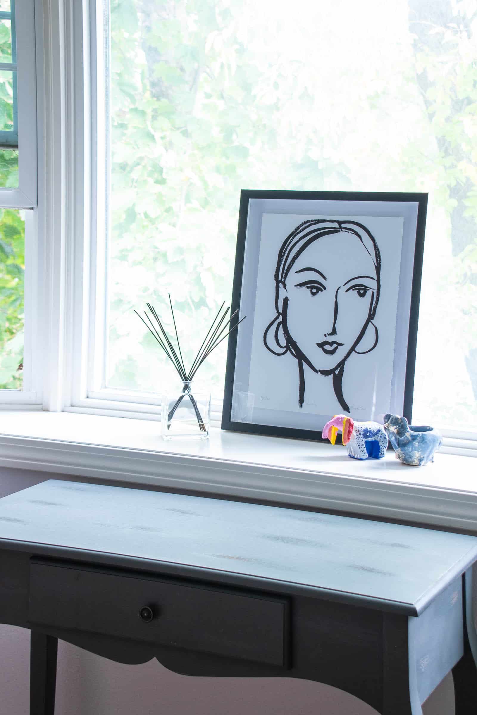 woman's painting in repainted bedroom