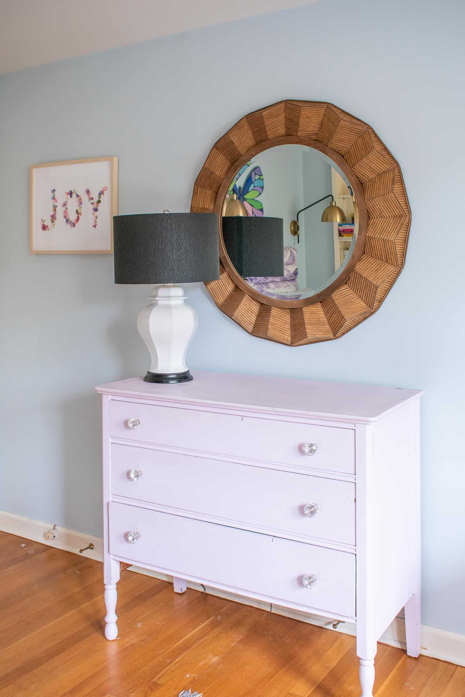 large rattan mirror in girls room