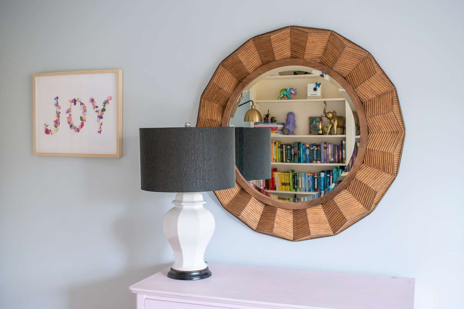 large rattan mirror in girls room