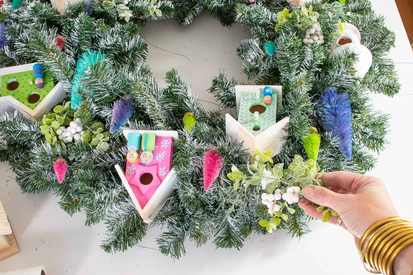 https://atcharlotteshouse.com/wp-content/uploads/2020/12/Flocked-Wreath-with-Mini-Houses-and-Trees-25.jpg