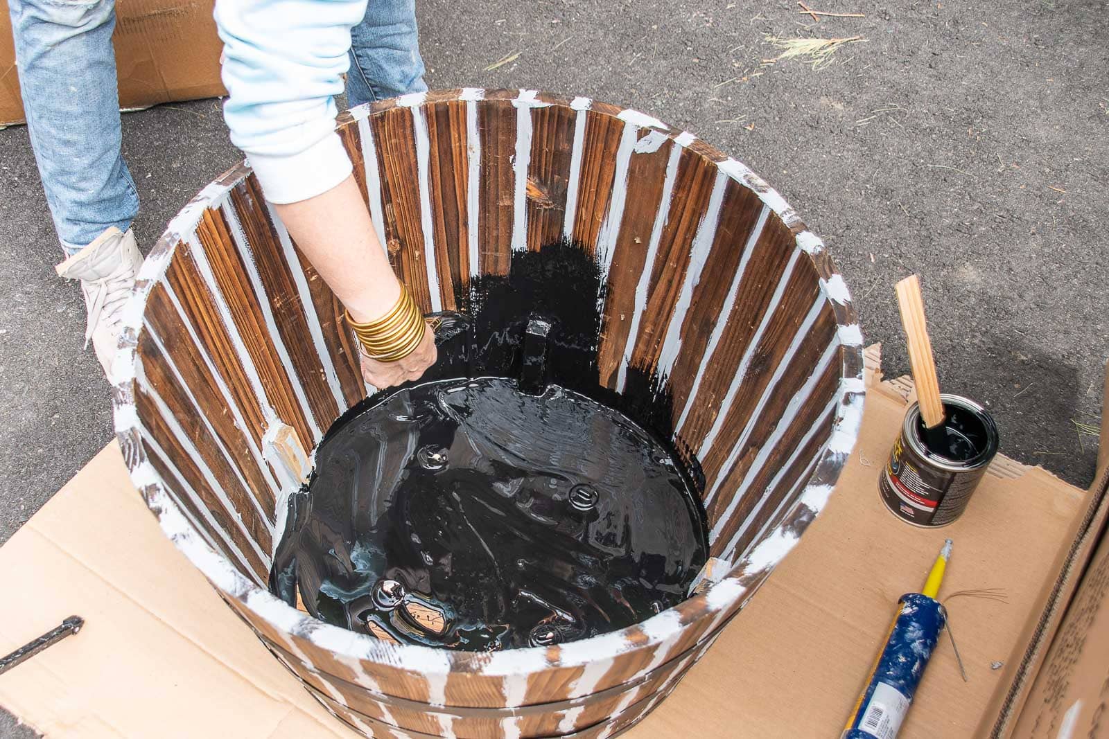 paint the inside of the barrel planter with flex sael