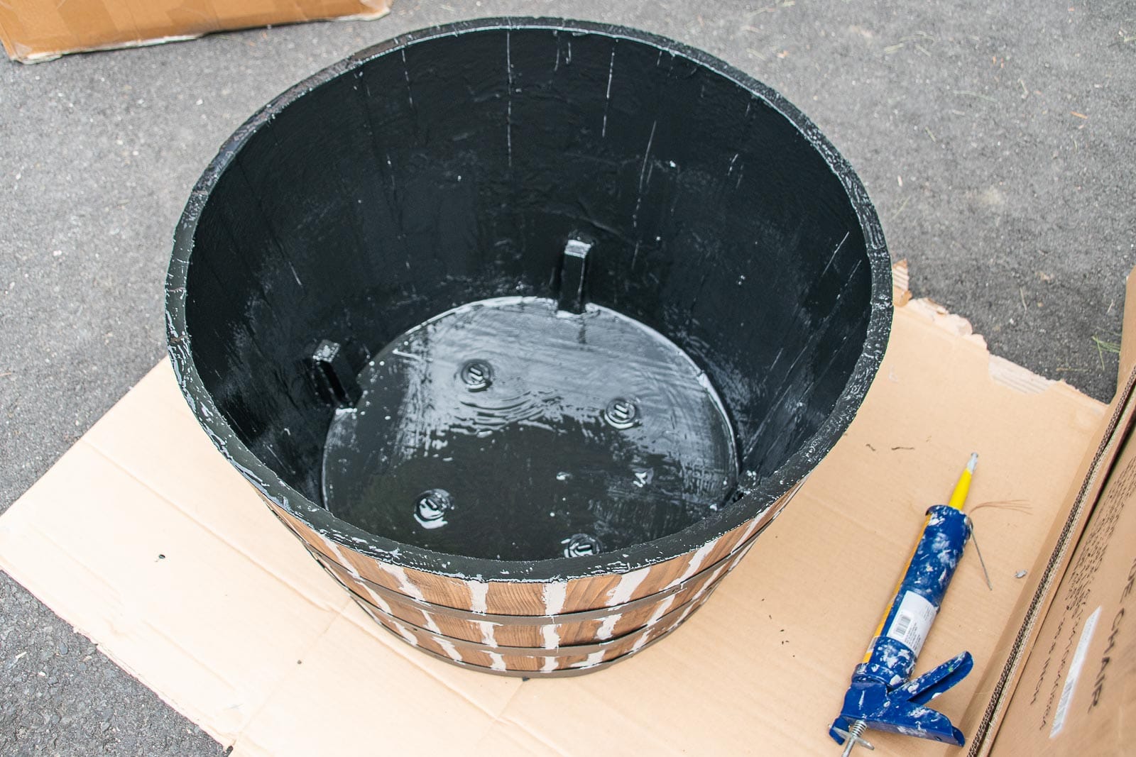 paint the inside of the barrel planter with flex sael