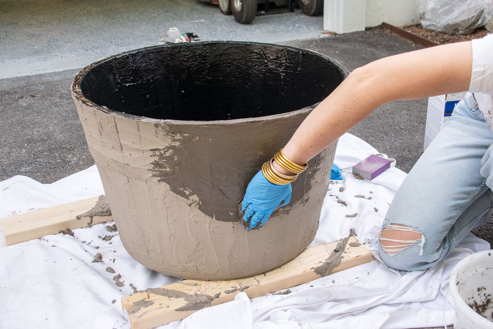 cover the outside of the planter with concrete