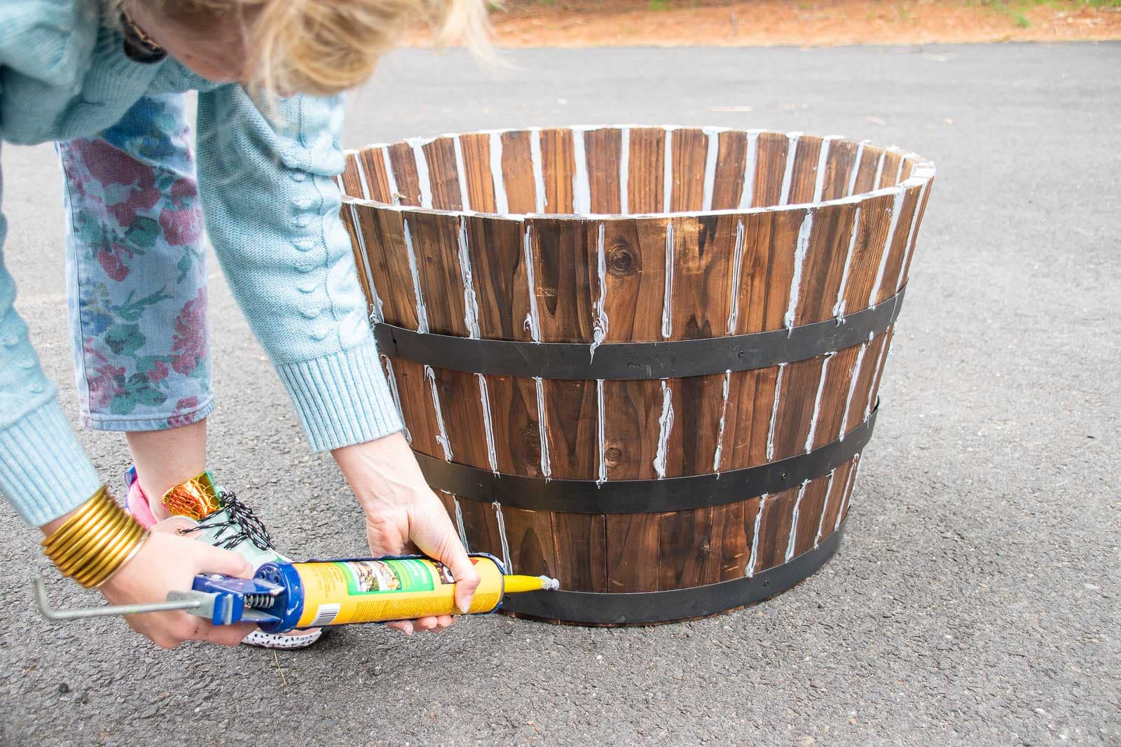 caulk the seams of the barrel planter