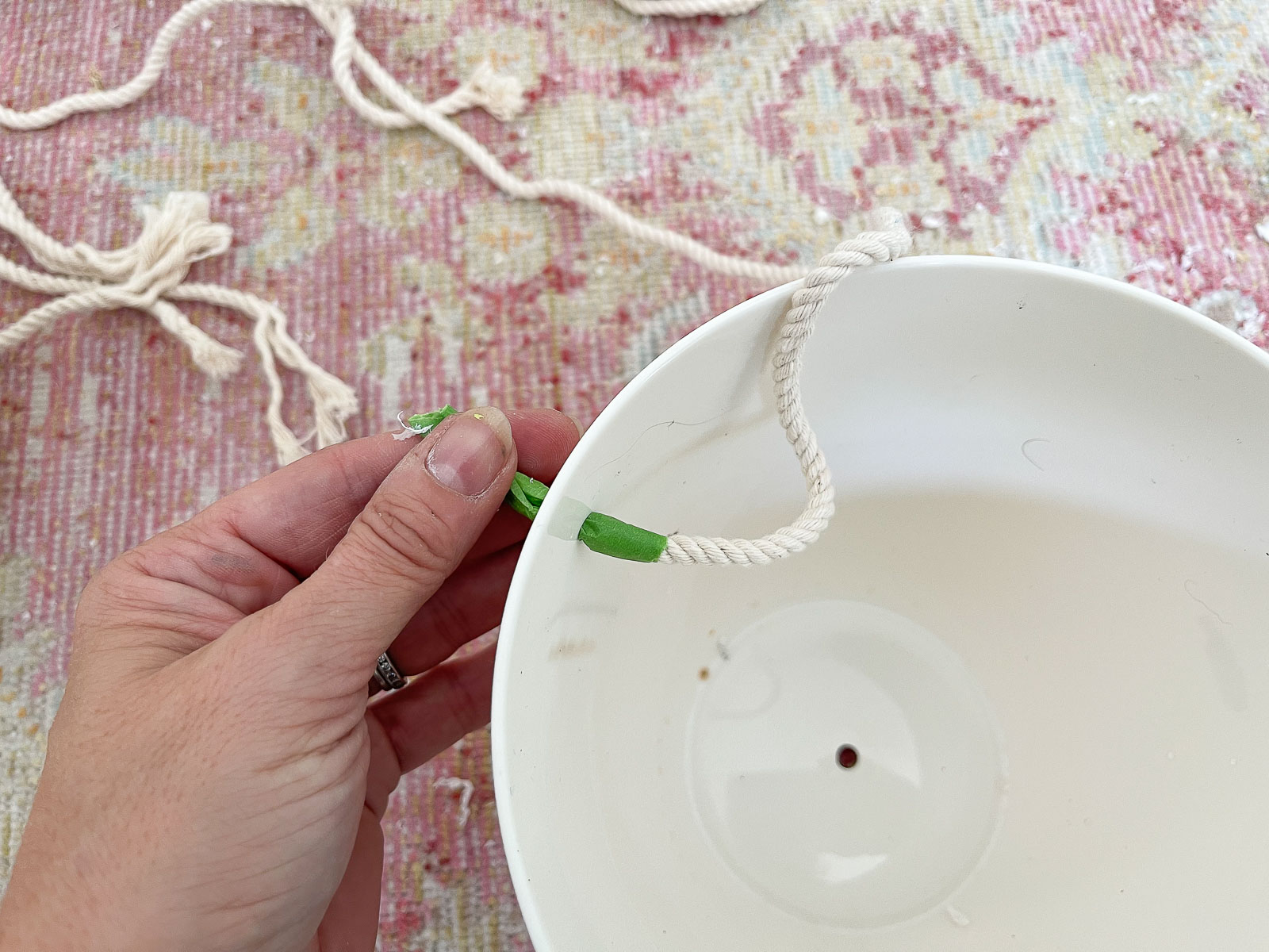 thread rope through pots for hanging