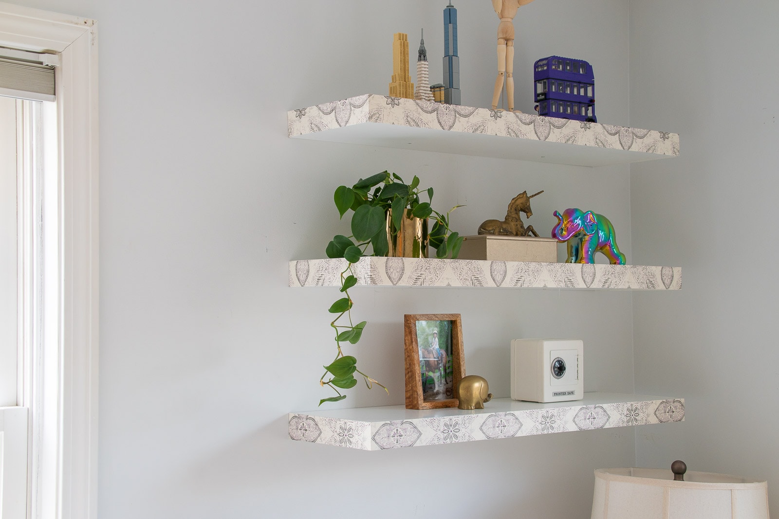 wallpaper covered floating shelves