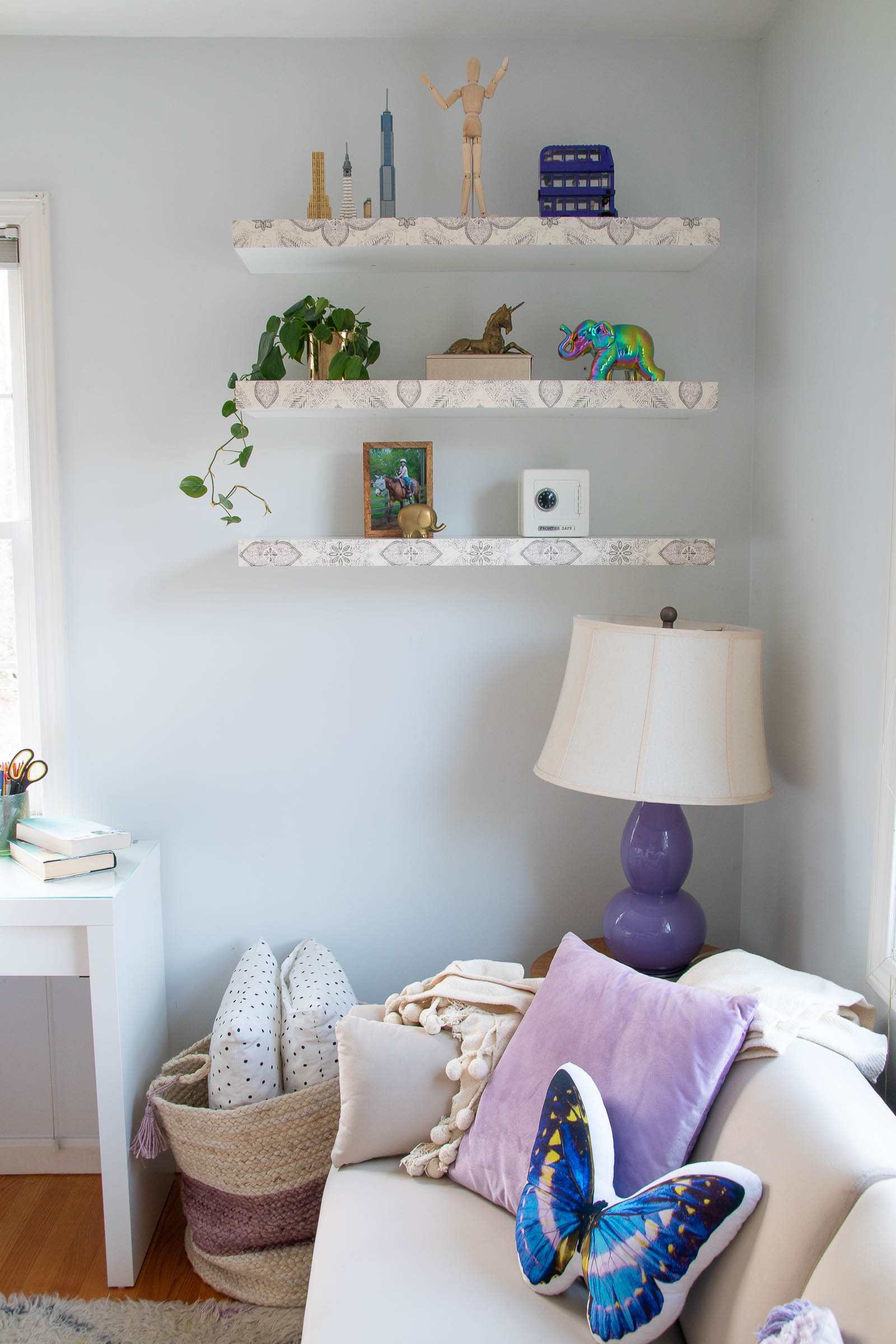 wallpaper on floating shelves in bedroom