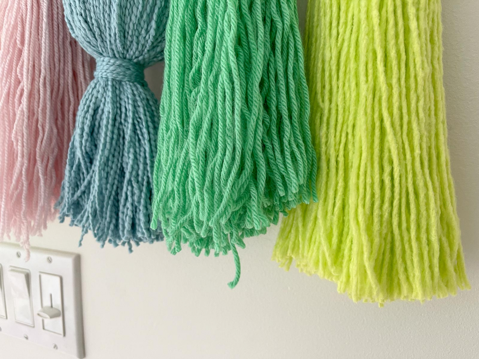 Colorful DIY Yarn Wall Hanging At Charlotte's House