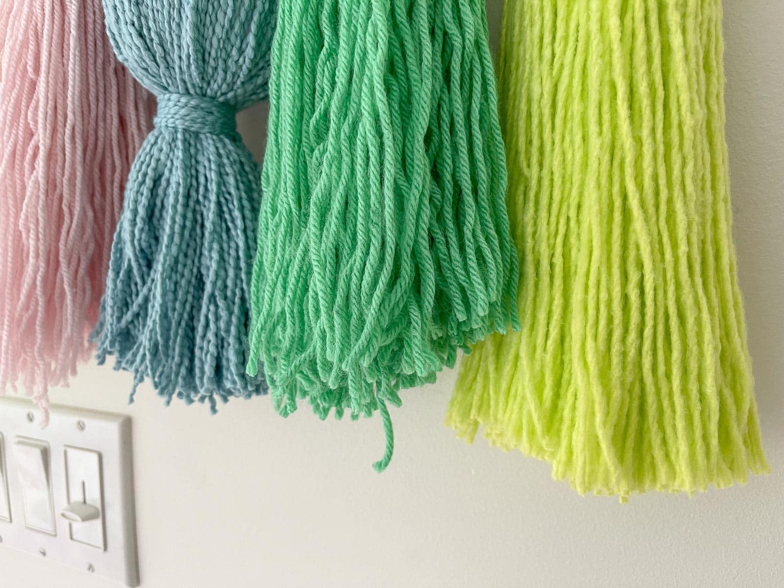 Trim the ends of yarn on each tassel