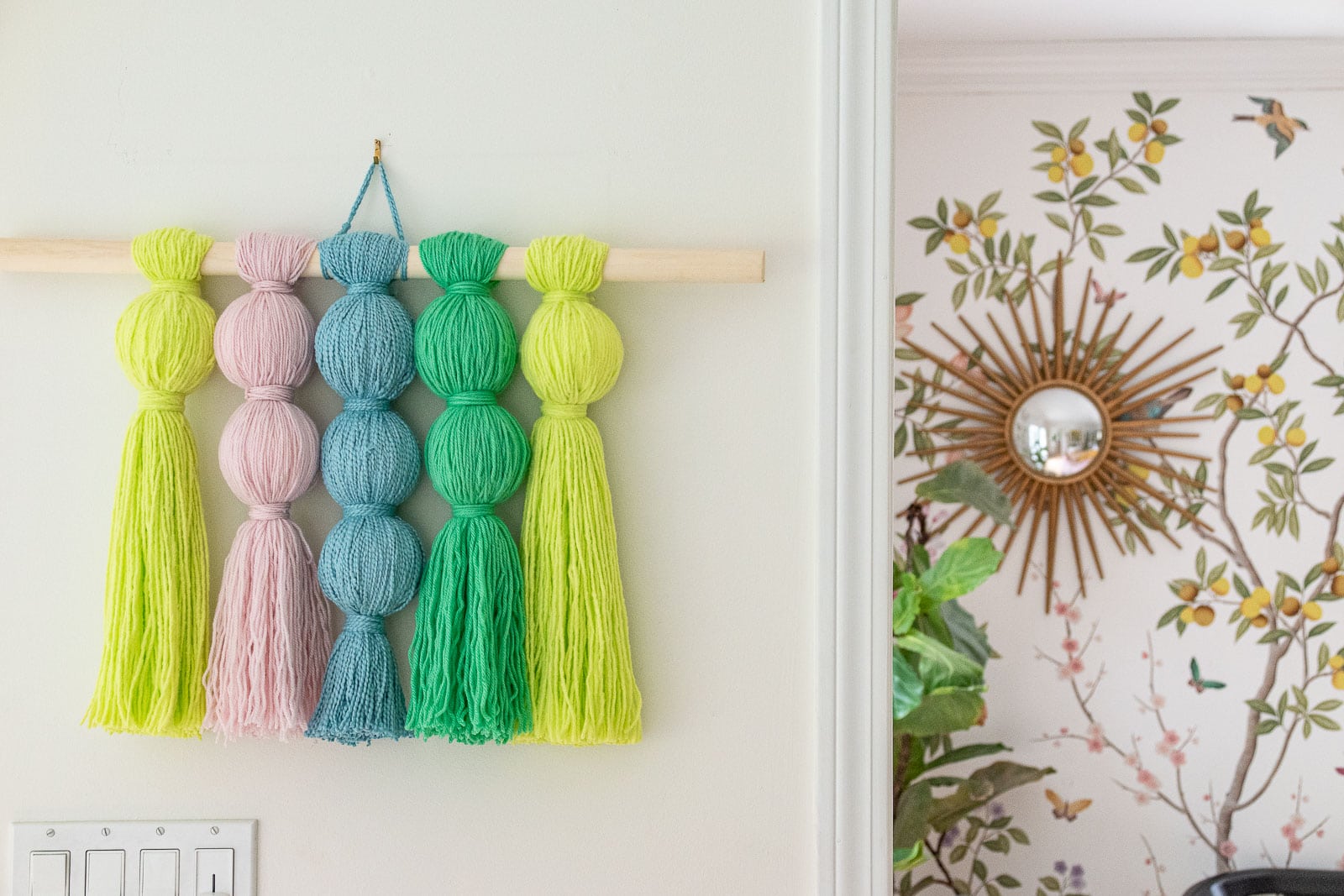 DIy colorful yarn wall hanging