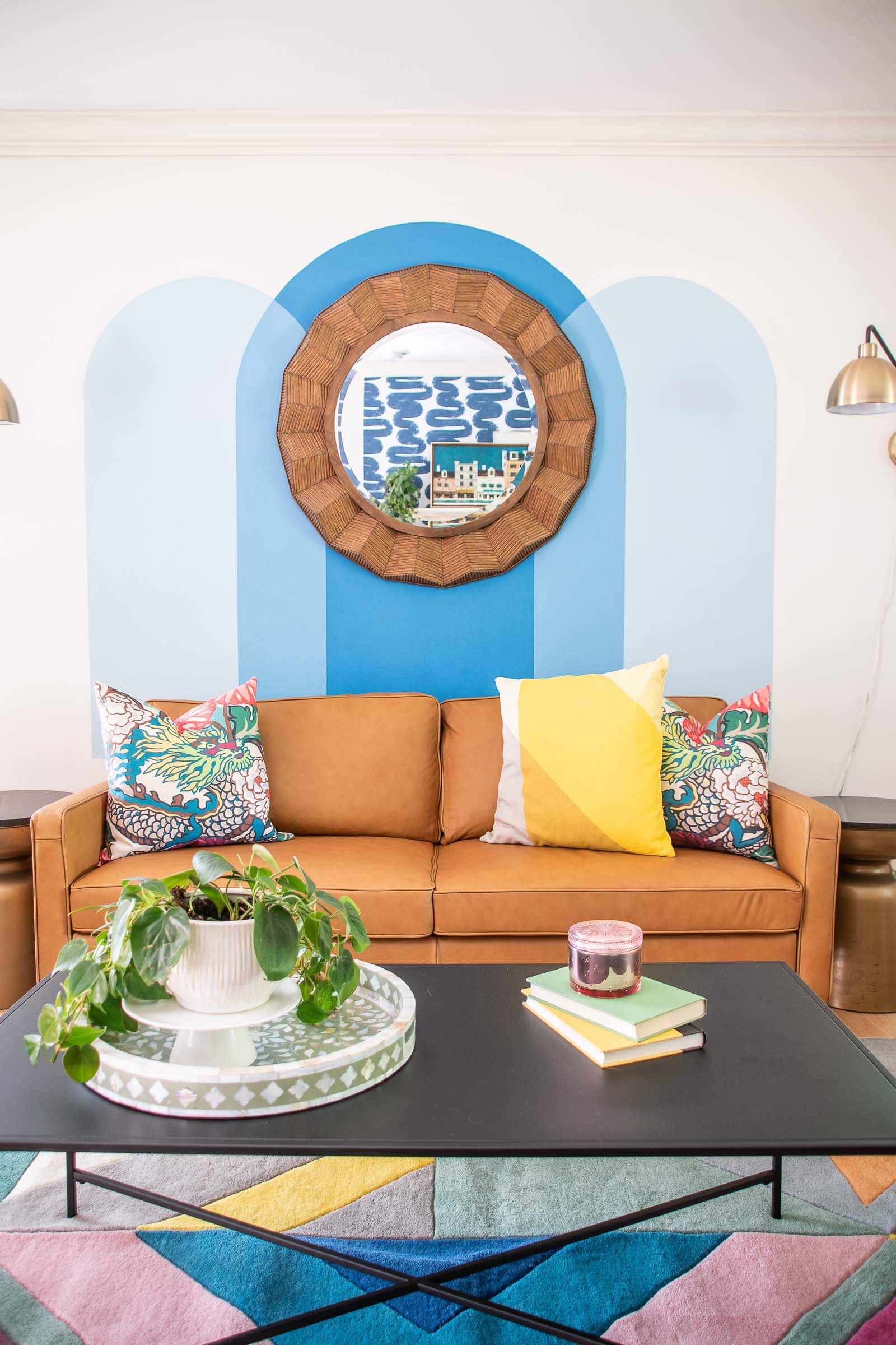 leather couch and colorful rug in our family room