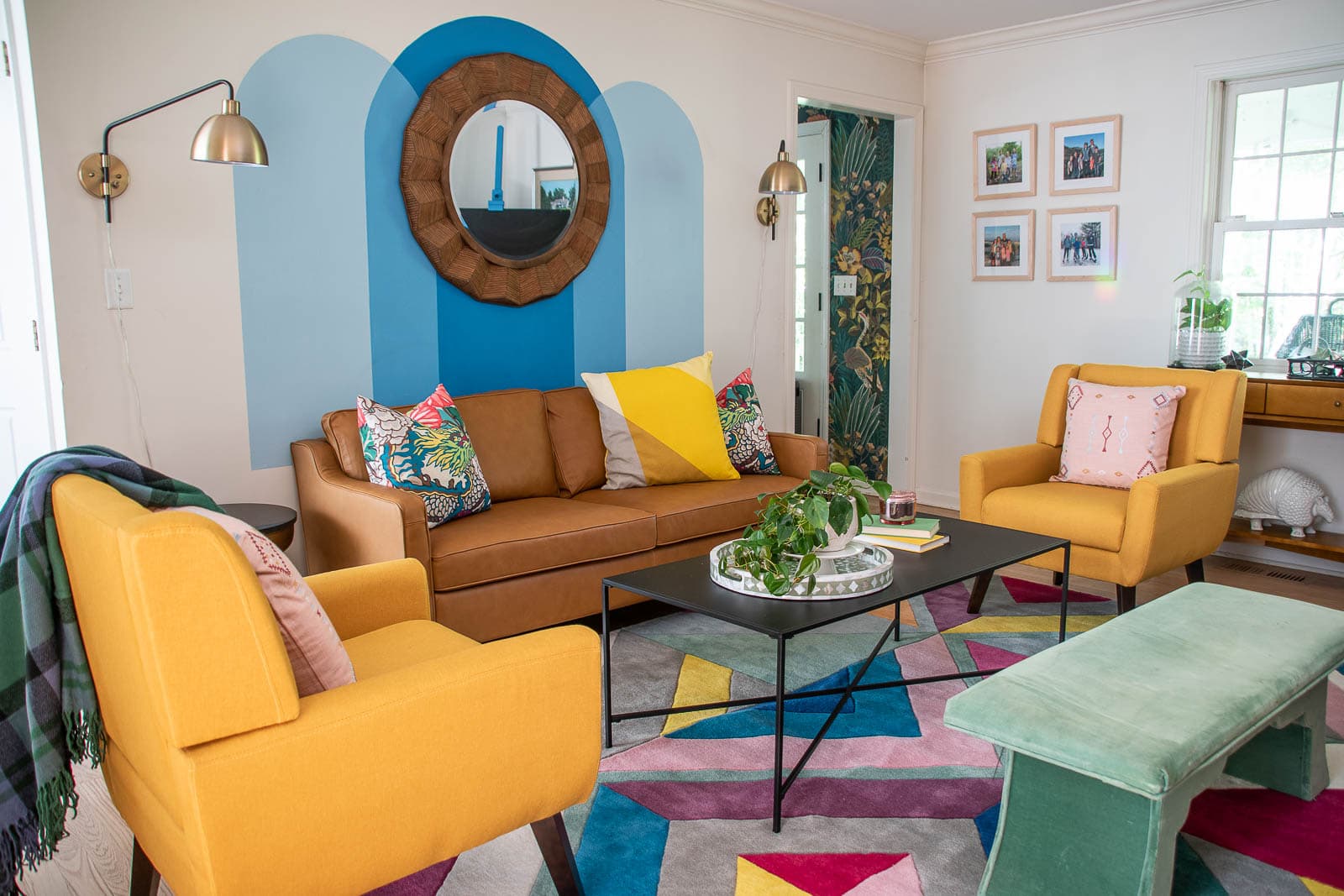 leather couch and colorful rug in our family room