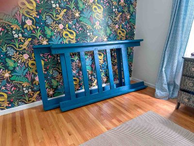 back wall of boy's bedroom with wallpaper