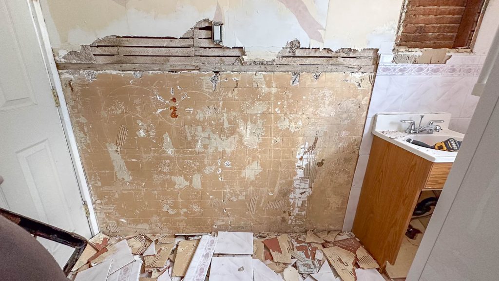 removing tiles from the flip house bathroom