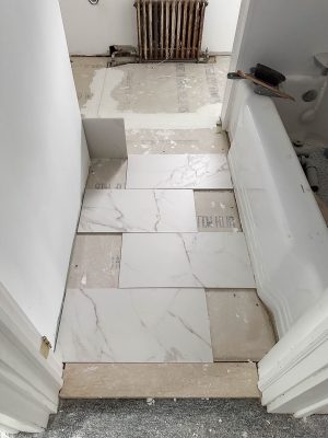 laying bathroom floor tile