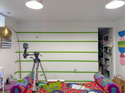 taping out rows of mural