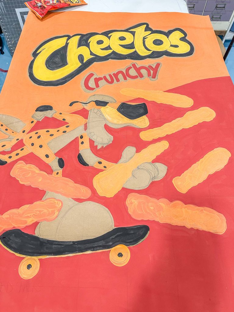 filling in the cheetos bag with paint