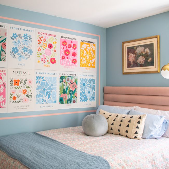picture of blue bedroom makeover with upholstered pink headboard and decorative flower art