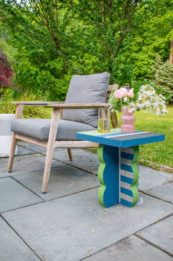 painted striped side table from concrete pavers