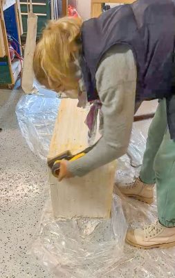 sanding down the waterfall bench