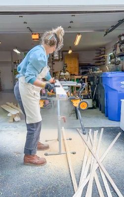 running 2x4s through the table saw to trim the edges