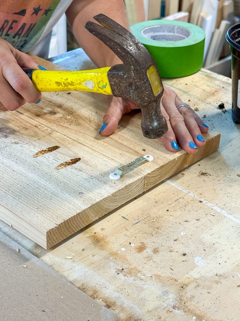 connect hanging hardware to back of cedar plank