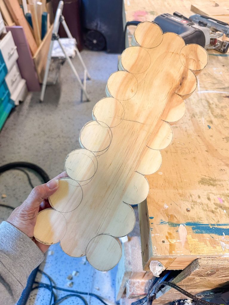 cut out scallop pattern around the edge of pine board