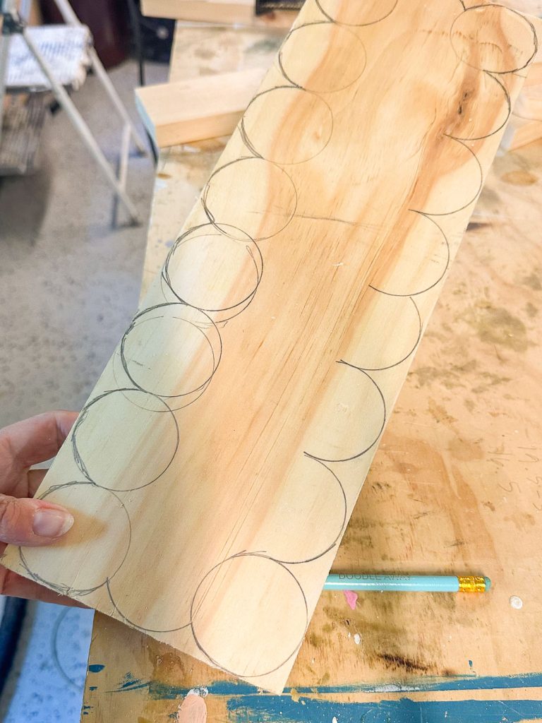 traced scallops around the edge of this pine board